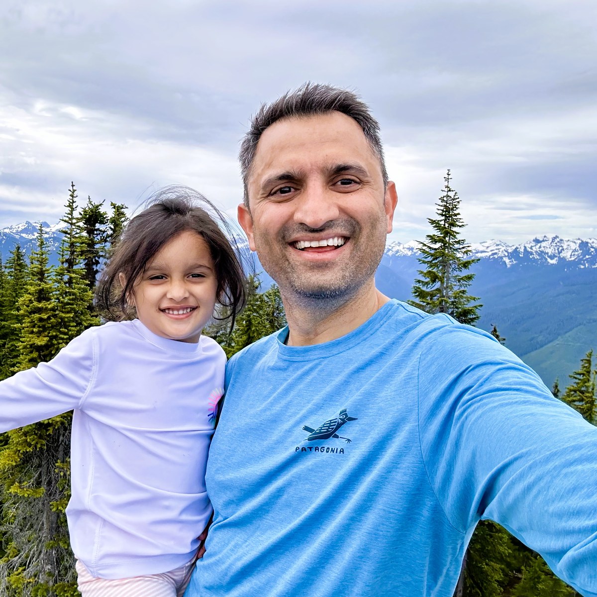 Abhijit Joshi with his daughter on a mountain summit