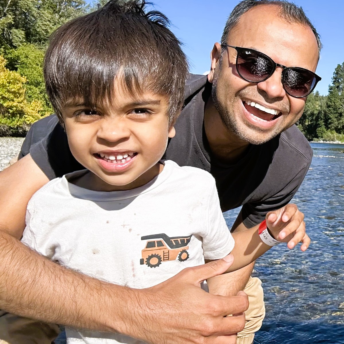 Kedar Joshi with his son by a river